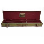 A CANVAS AND LEATHER TAKE-DOWN RIFLE CASE, fitted for a 30in. barrel, the interior lined with red