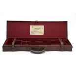 C.G. BONEHILL A BRASS-CORNERED LEATHER SINGLE GUNCASE, fitted for 28in. barrels, the interior