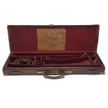 J. & W. TOLLEY A BRASS-CORNERED LEATHER SINGLE GUNCASE WITH PROVISION FOR EXTRA BARRELS, fitted