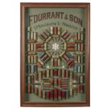 F. DURRANT & SON (WORCESTER) A GLAZED AND FRAMED SHOTGUN CARTRIDGE DISPLAY BOARD, measuring