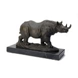 A BRONZE SCULPTURE OF A BLACK RHINOCEROS, mounted on a marble plinth, measuring approx. 16in. x 9in.