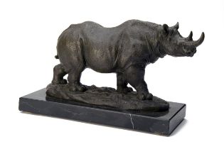 A BRONZE SCULPTURE OF A BLACK RHINOCEROS, mounted on a marble plinth, measuring approx. 16in. x 9in.