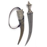 A LARGE WHITE-METAL MOUNTED KHANJAR DAGGER, South Arabia circa 1900, with 17in. curving double-edged