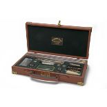 PENDLETON ROYAL AN UNUSED LUXURY TAN LEATHER 'LONDON' 12-BORE GUN CLEANING KIT, containing a green