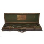 WILLIAM POWELL & SON A BRASS-CORNERED LEATHER-BOUND OAK SINGLE HAMMERGUN CASE, fitted for 30in.