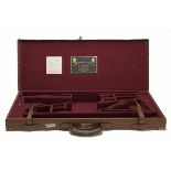 JAMES PURDEY & SONS LTD. A BRASS-CORNERED LEATHER DOUBLE GUNCASE, fitted for 28in. barrels (could