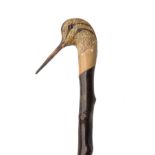A FINE HAND-CARVED SPORTSMAN'S STAFF, measuring approx. 46 5/8in. in length, the top carved and