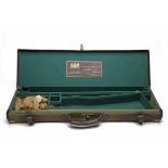 A BRASS-CORNERED CANVAS AND LEATHER SINGLE GUNCASE, fitted for 28in. barrels, the interior lined