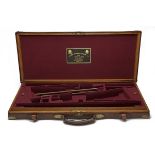 JAMES PURDEY & SONS LTD. A BRASS-CORNERED OAK AND LEATHER DOUBLE GUNCASE, fitted for 30in.