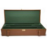 A TAN LEATHER TRIPLE UNIVERSAL GUNCASE, fitted for 30in. barrels, the interior lined with green