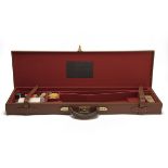 A LEATHER SINGLE GUNCASE, fitted for 30in. barrels, the interior lined with red baize, brass lock (