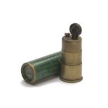 ELEY-NOBEL FOR M. GARNETT, DUBLIN A BRASS PETROL CIGARETTE LIGHTER IN THE FORM OF A SHOTGUN