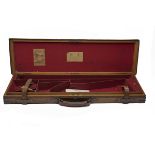 JAMES PURDEY & SONS A BRASS-CORNERED OAK AND LEATHER SINGLE GUNCASE, fitted for 30in. barrels, the