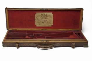 JAMES WOODWARD & SONS A BRASS-CORNERED OAK AND LEATHER SINGLE GUNCASE WITH PROVISION FOR EXTRA