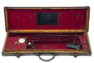 A BRASS-CORNERED OAK AND LEATHER SINGLE SMALL-BORE GUNCASE, fitted for 27 1/4in. barrels, the