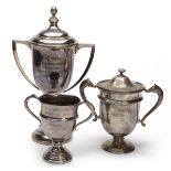 THREE VINTAGE TWIN-HANDLED SHOOTING TROPHIES, including a 1931 Birmingham hallmarked silver cup