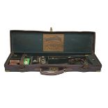 CHARLES & H. WESTON A BRASS-CORNERED LEATHER SINGLE GUNCASE, fitted for 30in. barrels, the