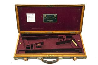 JAMES PURDEY & SONS A BRASS-CORNERED LEATHER DOUBLE GUNCASE, fitted for 28in. barrels, the