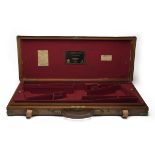 JAMES PURDEY & SONS A BRASS-CORNERED OAK AND LEATHER DOUBLE GUNCASE, fitted for 29in. barrels, the