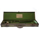 COGSWELL & HARRISON A BRASS-CORNERED CANVAS AND LEATHER SINGLE GUNCASE, fitted for 30in. barrels,