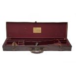 JOHN BLANCH & SON A BRASS-CORNERED LEATHER SINGLE GUNCASE, fitted for 30in. barrels, the interior