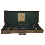 WESTLEY RICHARDS A BRASS-CORNERED CANVAS AND LEATHER DOUBLE GUNCASE, fitted for 30in. barrels, the