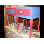 A pair of painted bedside cabinets