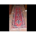 A Middle Eastern runner with geometric border