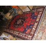 A Middle Eastern Shirz rug with red ground - 270cm