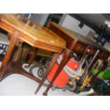 A mahogany desk with inset green leather top toget