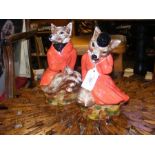 Two ceramic figures depicting foxes