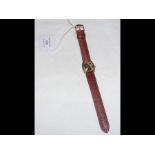 A ladies 18ct wrist watch with leather strap