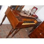 A 19th century square piano on turned supports