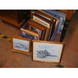 An assortment of framed and glazed prints and pict