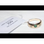An emerald and diamond ring in 9ct gold setting