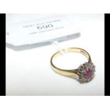 An 18ct diamond and ruby cluster ring - size M/N