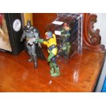 Two Judge Dredd action figures, together with a Ba