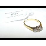 An 18ct three stone diamond ring - size N/O