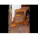 A pine dressing table mirror with drawers under