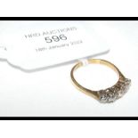 An 18ct five stone diamond ring - size M