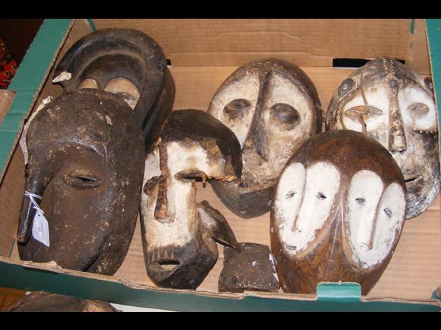 Six old carved African masks (varying condition)