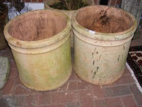 Two large terracotta circular plant pots