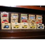 A selection of boxed die cast vans and busses