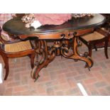 A 19th century oval dining table with shaped suppo