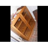 An Ercol two door display cabinet