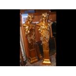 A pair of gilt female figural plinths - 160cms hig