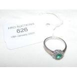 An emerald and diamond ring - size L (approx.)