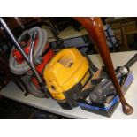 A Dewalt DC500 Wet N Dry vacuum cleaner and assorted attachments, together with a Numatic (Henry)