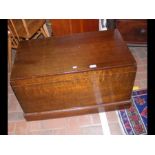 An antique sea chest with fitted interior and hand