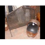 An old copper coal helmet, together with a spark g
